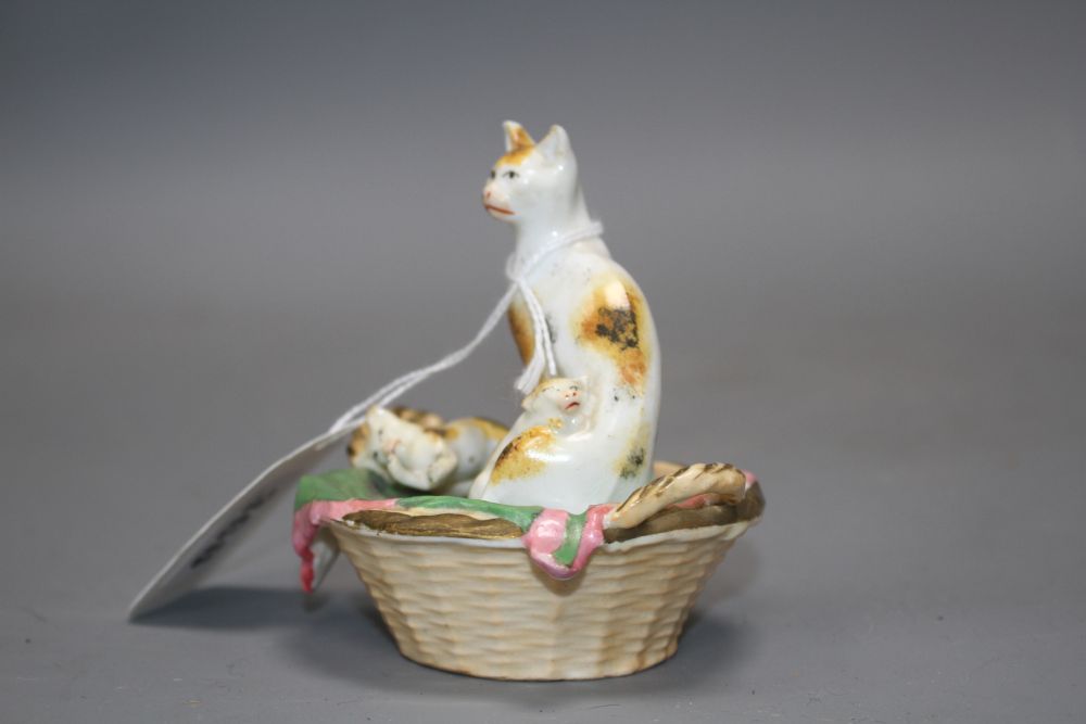 A Staffordshire porcelain group of a cat and two kittens in basket, c.1830-50, possibly Dudson,